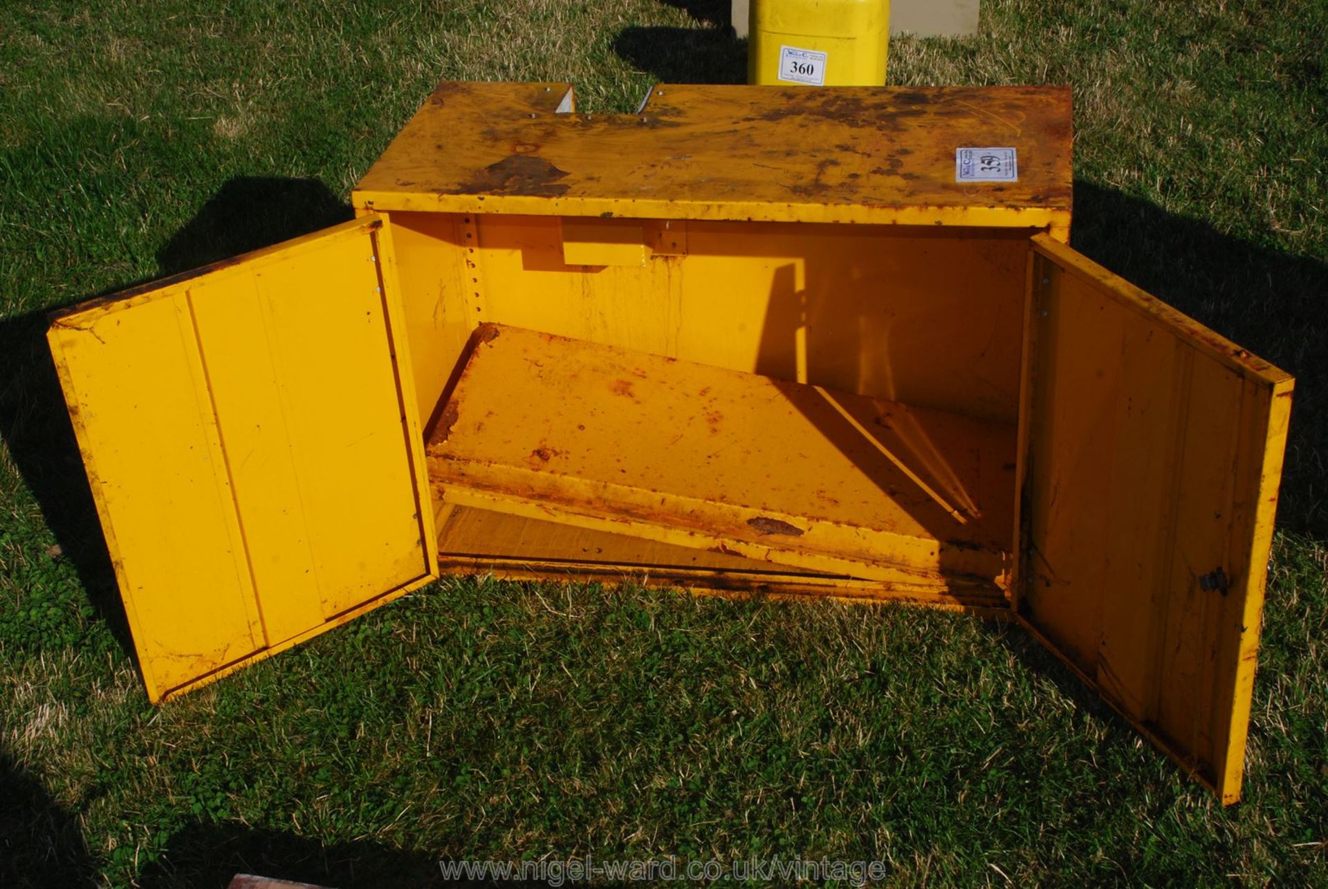 A yellow workshop cabinet.