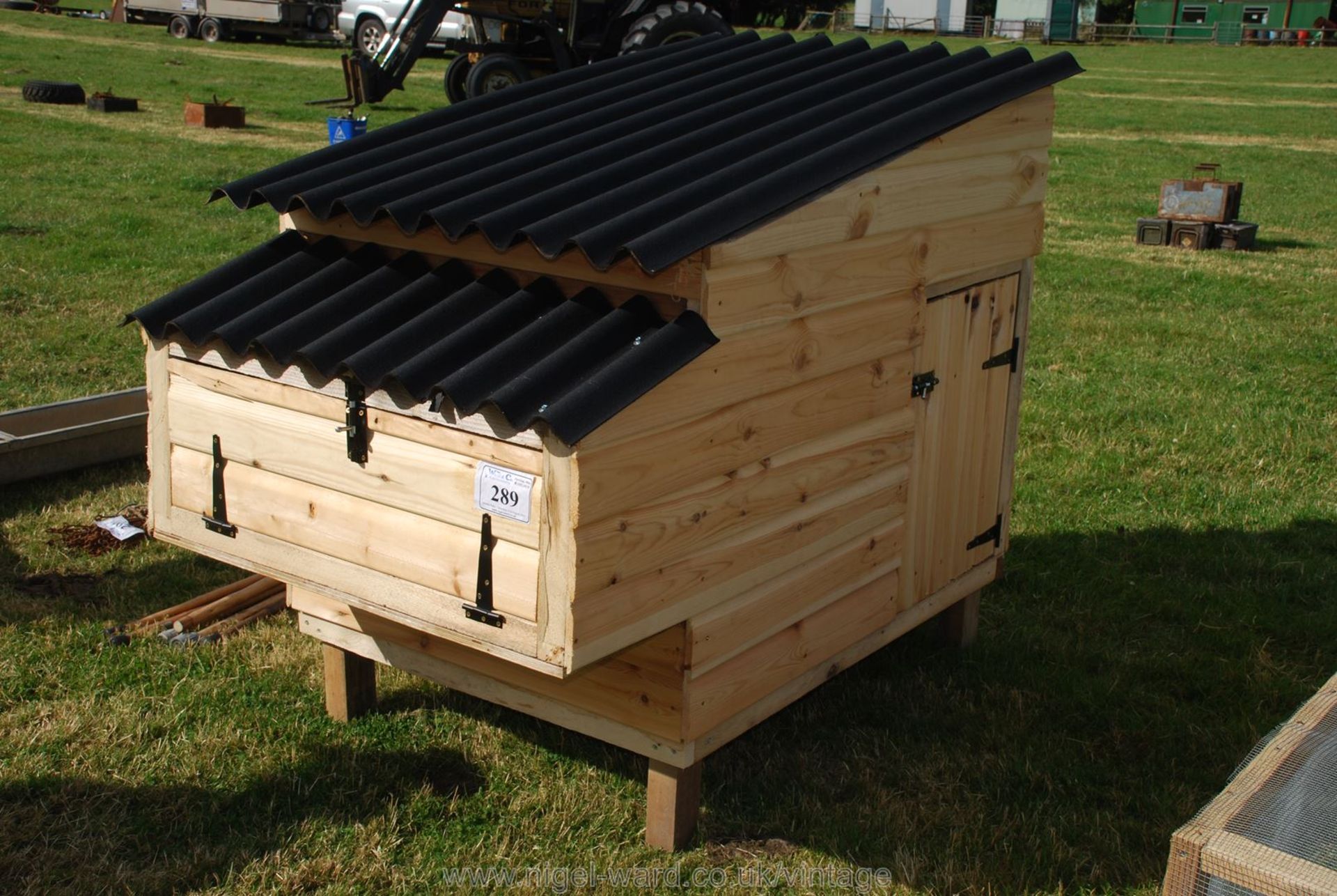 A chicken/poultry house with separate access for nesting boxes.