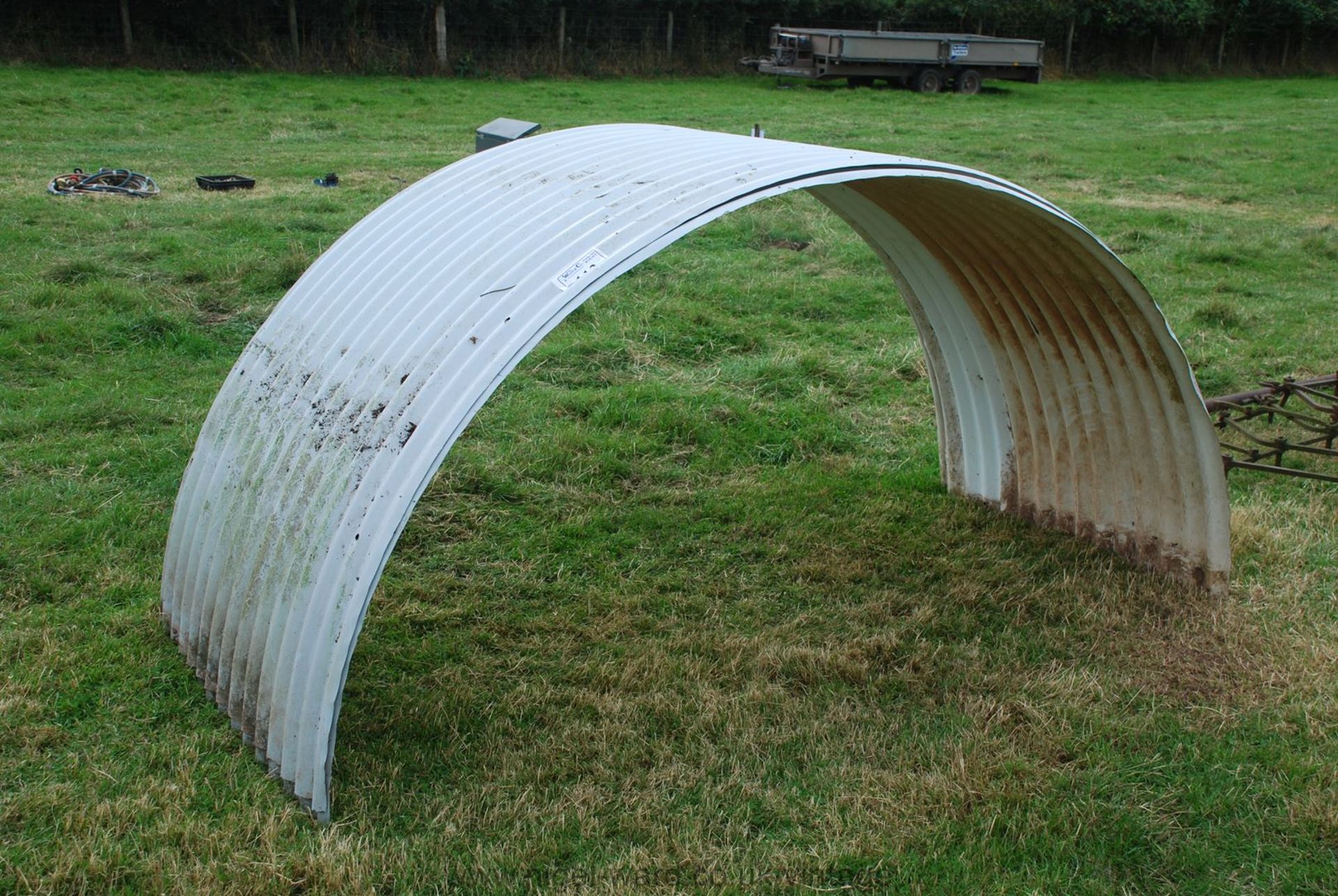 Two 8' span corrugated iron pig-arc roof sheets.