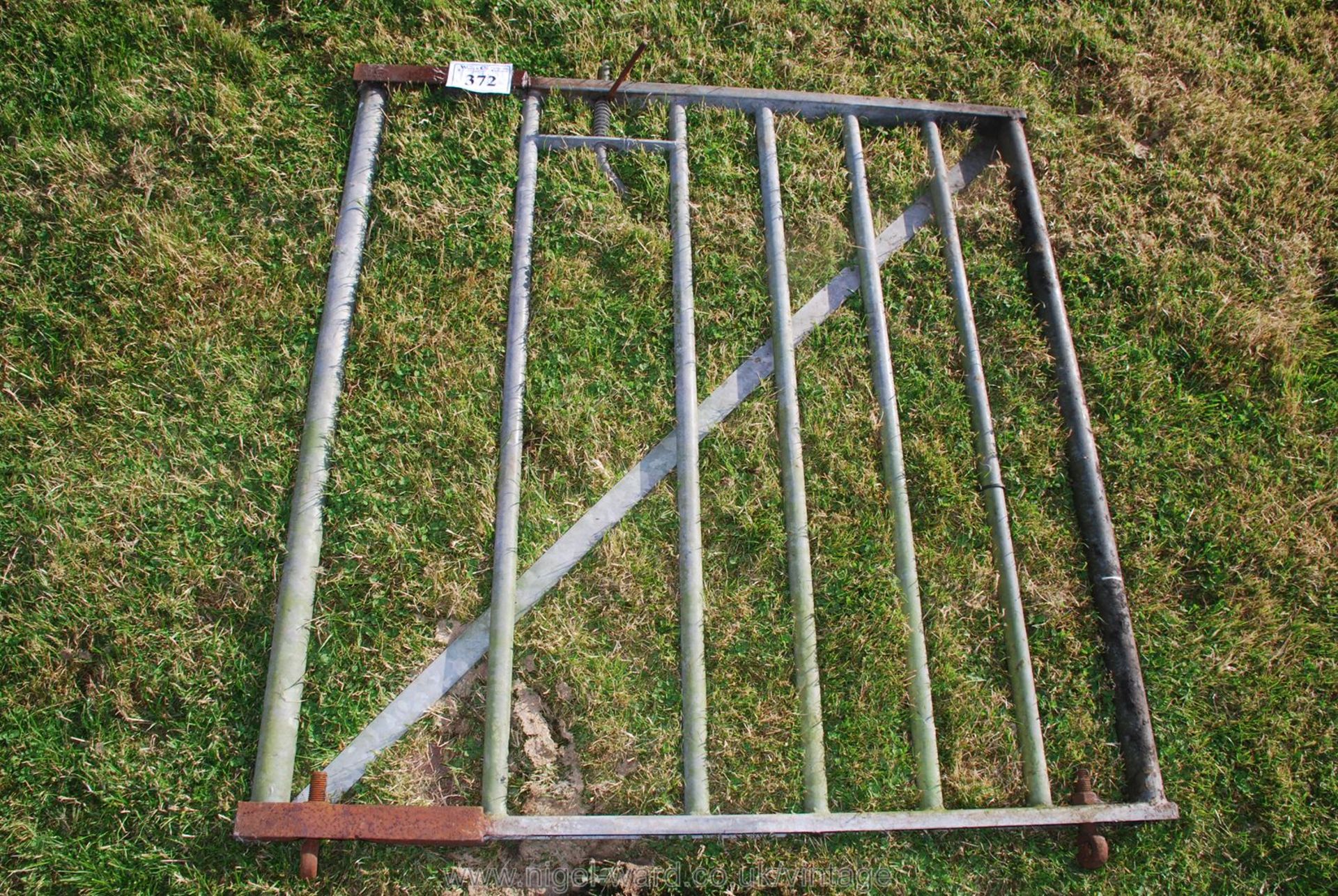 A galvanised field gate 4' x 4'.