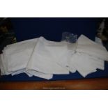 A quantity of white linen including Damask tablecloths, Swiss darning, etc.