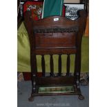 A Victorian billiard cue stand with drip tray, standing on paw feet, 38'' tall x 22'' wide approx.