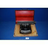 A small, collectable 1920's Gundka-werk Frolio, model III, Typewriter with cover, serial no. 22805.