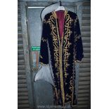 A blue velvet Kaftan style robe, heavily embellished with gold thread embroidered decoration,
