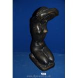 A stone model of a nude with distressed bronze style finish, 19" tall.