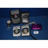 A Fujifilm Finepix 235 digital camera in purple together with a Canon IXUS Z50 digital camera with