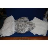 A quantity of white linen including Swiss darning tablecloths, lacework, etc. (some marks).