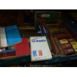 Two boxes of books of different countries and languages etc.