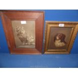 A wooden framed photograph of a cat along with an oil painting of a Dog.