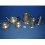 An Unity Pewter teaset, circa 1920 comprising teapot, sugar bowl and milk jug,