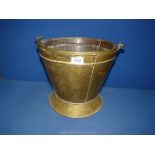 A brass coal bucket.