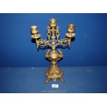 A brass three branch candelabra.