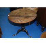 A tilt top table 29 1/2" x 27".