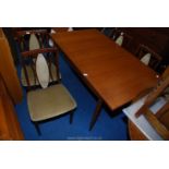 G Plan extending dining table with two extra leaves.
