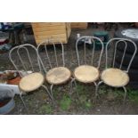 Set of four wood and metal kitchen chairs.