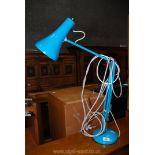 A blue anglepoise lamp.