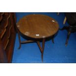 A 26" diameter occasional table.