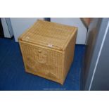 Wicker laundry/toy box with lid.