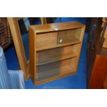 Light oak glass fronted bookcase