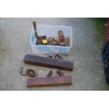 Plastic box of wood working planes and chisels.