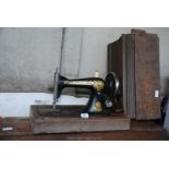 Wooden cased Singer hand sewing machine, F1617960.