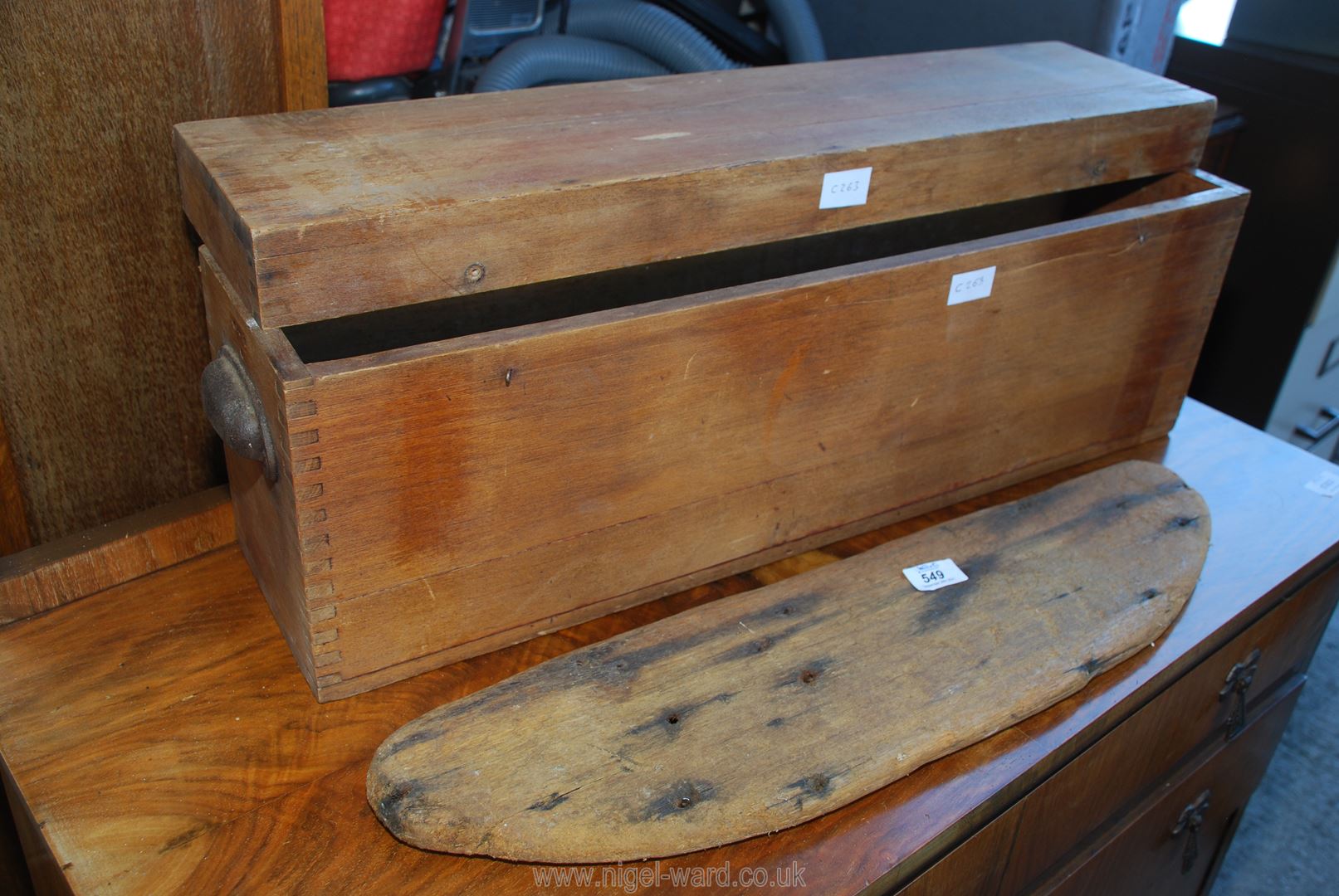 Wooden box with detachable lid and a piece of driftwood.