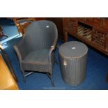 Lloyd Loom circular linen bin and matching bedroom chair.