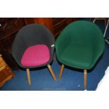 A pair of modern upholstered tub chairs.