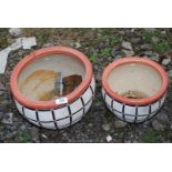 Two decorative pottery planters.