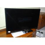 A Samsung 31" TV with remote.