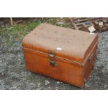 A metal travel trunk.