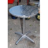 Snap top circular metal bistro table, 34'' diameter.