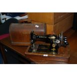 A cased Singer sewing machine, F5254877.