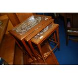 Nest of three tiled top tables.