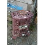 Godinette French wood burner in plum coloured enamel.