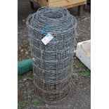 Coil of used pig netting.
