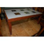 A glass topped wooden coffee table 39" x 23 1/2" x 16".