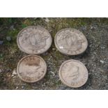 Four circular coin garden stepping stones in the form of half penny,