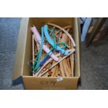 Large box of wooden clothes hangers.