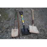 Two shovels, a spade and a metal bar.