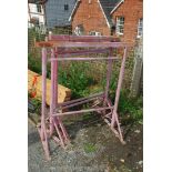 Two pairs of metal builders trestles.