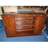 Wooden sideboard with three shelves to the centre.