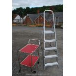 A two tier tea trolley and a four rung pair of aluminium steps.