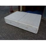 A double divan base with drawers.