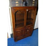 A glazed topped cabinet with two door cupboard beneath 36" x 55" x 13".