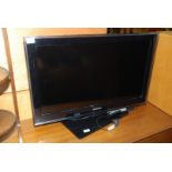A Samsung 31" TV with remote.