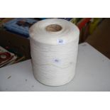 Large coil of white synthetic thread.