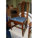 A high backed dining chair.