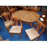A pine extending dining table 5' x 41 1/2" x 30" high extending to 75" with six dining chairs,