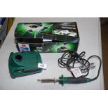 Boxed soldering iron and stand.